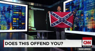 Illustration for article titled Don Lemon Holds Up N-Word Sign and Confederate Flag Asking if People Are Offended